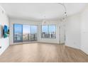 Living room featuring gorgeous floors, big windows, and city views at 1209 E Cumberland Ave # 1703, Tampa, FL 33602