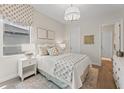 Cozy bedroom with nice natural light, a neutral color palette, and stylish decor at 15539 Stuart Cir, Port Charlotte, FL 33981