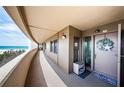 Exterior hallway of beachfront condo with views of the ocean and unit 303 at 4450 Gulf Blvd # 303, St Pete Beach, FL 33706