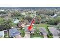 Spacious residential neighborhood featuring pond views and mature trees in a peaceful community at 4644 Braesgate Ct, Land O Lakes, FL 34639
