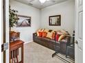 Cozy living room featuring a leather sofa and decorative accents at 7305 River Hammock Dr # 204, Bradenton, FL 34212