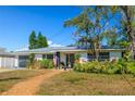 A charming single-story home featuring a garage, landscaping, and inviting front entrance at 1131 60Th Ave S, St Petersburg, FL 33705