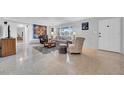 Bright living room featuring a polished terrazzo floor, neutral walls, and ample natural light at 2000 59Th N Way, St Petersburg, FL 33710