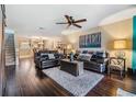 Spacious living room with hardwood floors, comfortable seating and a decorative ceiling fan at 2511 Dolly Bay Dr # 304, Palm Harbor, FL 34684