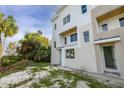 Side view of a modern townhouse showing the landscaping potential around the building at 3207 N Florida Ave # 1, Tampa, FL 33603