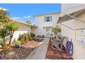 Inviting walkway leading to the home's entrance with a cozy seating area at 3280 39Th S St # B, St Petersburg, FL 33711