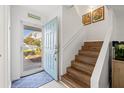 View of the home's interior from the open front door and adjacent staircase at 3280 39Th S St # B, St Petersburg, FL 33711