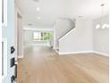 Bright living room boasts hardwood floors, recessed lighting, and a staircase leading to the upper level at 4017 W North B St, Tampa, FL 33607