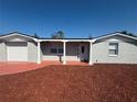 Charming single-story home with freshly mulched front yard and a brick facade at 4731 Foothill Dr, Holiday, FL 34690