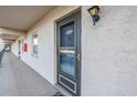 Exterior unit entrance with visible unit number and a well-maintained walkway at 8681 Bardmoor Blvd # 208C, Seminole, FL 33777