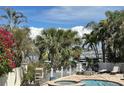 Inviting pool and spa area with a waterfront view and comfortable lounge chairs at 701 64Th Ave, St Pete Beach, FL 33706