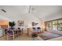Bright living room featuring vaulted ceilings, adjacent dining area and natural light at 8003 Bardmoor Pl # 204, Seminole, FL 33777