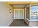 Charming entryway featuring double doors and decorative flooring at 14834 Crown Dr, Largo, FL 33774