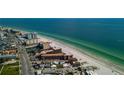 Picturesque aerial view of beachfront condominiums along the scenic coastline at 17580 Gulf Blvd # 302, Redington Shores, FL 33708