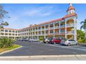 Charming condo building showcasing a classic design, ample parking, and well-kept landscaping at 2404 Florentine Way # 40, Clearwater, FL 33763