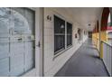 Exterior hallway with unit doors and white railings at 2430 Florentine Way # 44, Clearwater, FL 33763