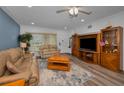 Inviting living room with neutral walls and a comfortable seating arrangement and wood-look flooring at 2430 Florentine Way # 44, Clearwater, FL 33763