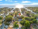 Stunning aerial view of waterfront property with access to the Gulf, lush landscaping, and neighborhood canals at 4911 W Melrose S Ave, Tampa, FL 33629