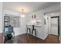 Eat-in kitchen features a breakfast bar with stools and views of laundry at 6916 Stones Throw N Cir # 9110, St Petersburg, FL 33710