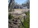 Charming new construction home featuring a well-manicured front lawn and attached two-car garage at 8204 Chimney Rock Dr, Webster, FL 33597