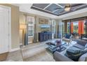 Comfortable living room features neutral walls, stylish ceiling, and patio access at 10446 Highland Park Pl, Palmetto, FL 34221
