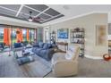 Inviting living room with modern decor, comfortable seating, and sliding doors to the lanai at 10446 Highland Park Pl, Palmetto, FL 34221