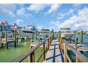 Boat dock featuring multiple boat slips, perfect for boat enthusiasts at 130 Brightwater Dr # 5, Clearwater Beach, FL 33767