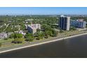 A lovely aerial view of the community, nearby buildings, and the water at 2405 S Ardson Pl # 303A, Tampa, FL 33629
