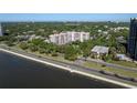 Enjoy an aerial view of this condominium complex near the water at 2405 S Ardson Pl # 303A, Tampa, FL 33629