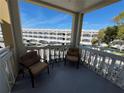 Comfortable balcony area with seating and views of the property at 2431 Franciscan Dr # 45, Clearwater, FL 33763