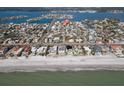 Breathtaking aerial view showcasing a waterfront home location near a pristine beach and beautiful bay at 305 160Th Ter, Redington Beach, FL 33708