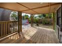 Relaxing covered patio with wooden floors and view of the backyard pool area at 4162 3Rd N Ave, St Petersburg, FL 33713