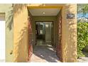 Elegant foyer with decorative metal gates leading to a staircase and an open living space at 4907 Bayshore Blvd # 115, Tampa, FL 33611
