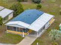 An elevated view of the home displaying the yard, and features of the community at 4920 Blanco Dr, Zephyrhills, FL 33541