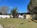 Charming single-story home with a lush green lawn and freshly planted landscaping at 5751 94Th N Ave, Pinellas Park, FL 33782