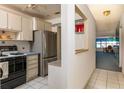 Functional kitchen design featuring modern appliances and ample cabinet space at 6025 Shore S Blvd # 410, Gulfport, FL 33707