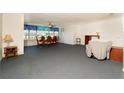 Spacious living room featuring an open layout with dining area and ample natural light at 6025 Shore S Blvd # 410, Gulfport, FL 33707