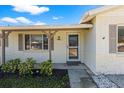 Inviting front porch of a well-maintained home, accented by manicured landscaping and a cozy entrance at 6337 S Lansdale Cir, Tampa, FL 33616