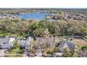 Aerial view of the property showcasing its location near a lake, community, and surrounding landscape at 12030 Steppingstone Blvd, Tampa, FL 33635