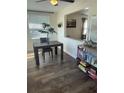 Bright dining area featuring a wood table, large window, and decorative shelving at 2235 20Th St S, St Petersburg, FL 33712