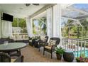 Relaxing screened lanai with comfortable seating and dining area, perfect for outdoor enjoyment at 4603 S Bartlett St, Tampa, FL 33611