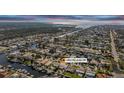 Beautiful aerial view of waterfront community highlighting the canal access and home's location at 4942 Pelican Dr, New Port Richey, FL 34652
