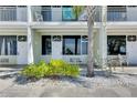 Beautifully landscaped condo with outdoor seating and beach access, perfect for relaxing in the coastal breeze at 611 Destiny Dr # 304, Ruskin, FL 33570