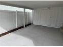 Spacious carport featuring white fencing, providing privacy and ample parking space at 7909 N Packwood Ave, Tampa, FL 33604
