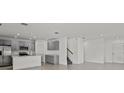 Bright, open floor plan with a contemporary kitchen with stainless steel appliances at 6259 Springmont Loop, Palmetto, FL 34221