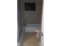 Bathroom featuring tile flooring, and a shower with tile surround at 10367 Councils Way, Temple Terrace, FL 33617