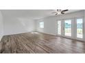 Bright and open living room featuring stylish flooring and access to the outdoor space at 108 Pompano Se Dr # A, St Petersburg, FL 33705