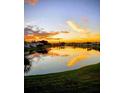 Scenic lake view with vibrant sunset colors reflecting on the water's surface at 122 Pompano Se Dr # A, St Petersburg, FL 33705