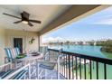 Relax on your balcony, overlooking the scenic waterways with dining set and ceiling fan at 3111 Pass A Grille Way # 213, St Pete Beach, FL 33706