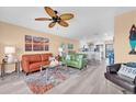 A bright living room features comfortable seating, stylish decor, and an open layout to the kitchen at 3111 Pass A Grille Way # 213, St Pete Beach, FL 33706